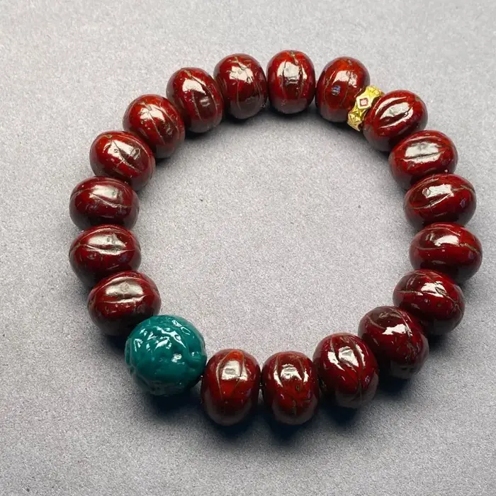Bracelet tibétain en œil de phénix rouge de 14mm
