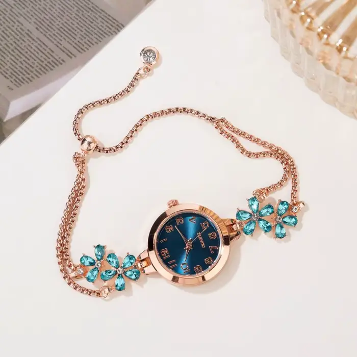 Montre-bracelet femme élégante à quartz avec motif fleurs boîtier métal et boucle bijoux pour style luxe affaires et sport