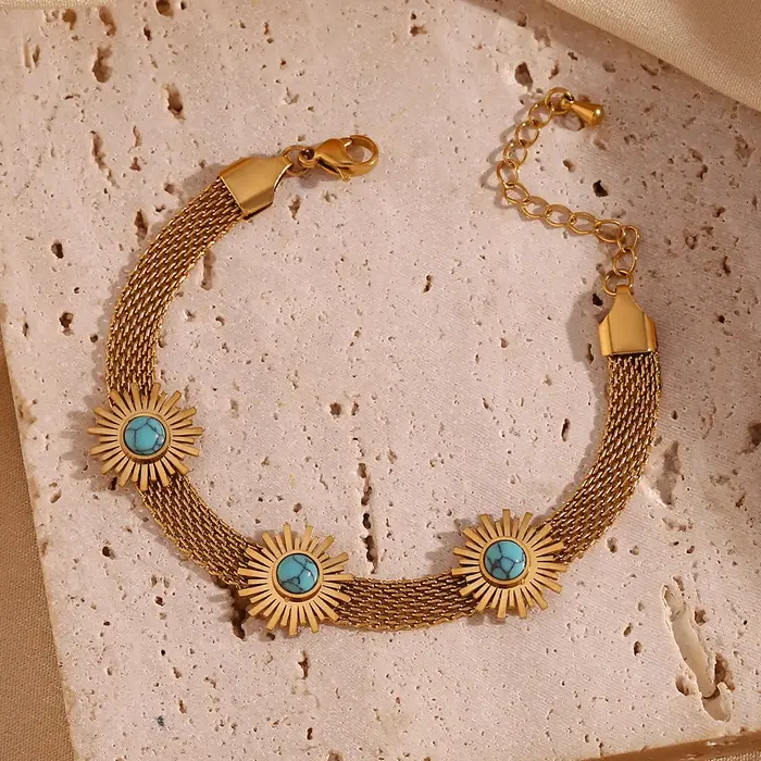 Bracelet en maille tissée bleu turquoise avec motif tournesol pour femmes occasions estivales et élégantes