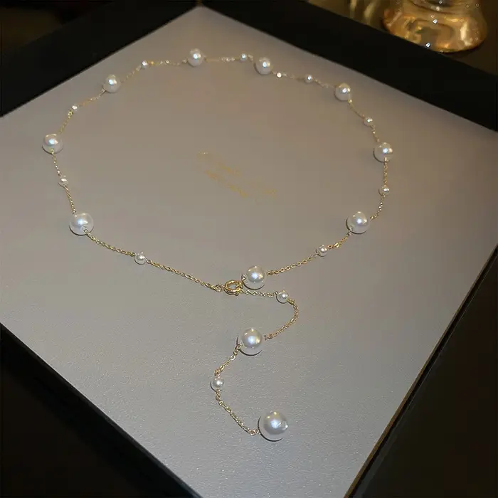 Nouveau Simple Long Imitation perles dos collier pour femmes Sexy gland perle harnais Bikini poitrine chaîne corps bijoux Mujer