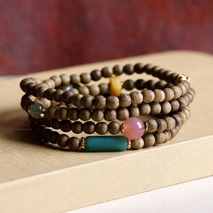 Bracelet multi-entrelacé avec bois d'agar, cire d'abeille, jaspe, perle et agate rouge, style chinoi