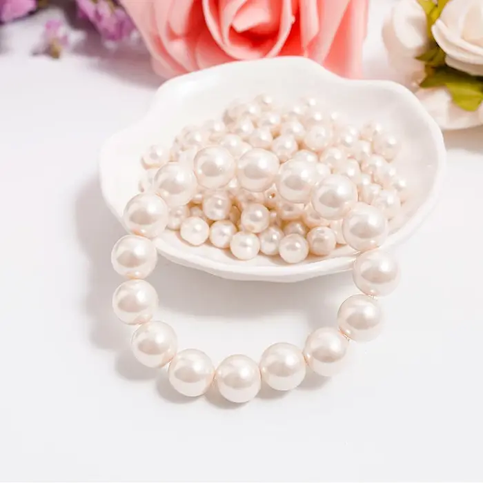 Bracelet classique élégant en perles blanches élastiques pour femmes et hommes