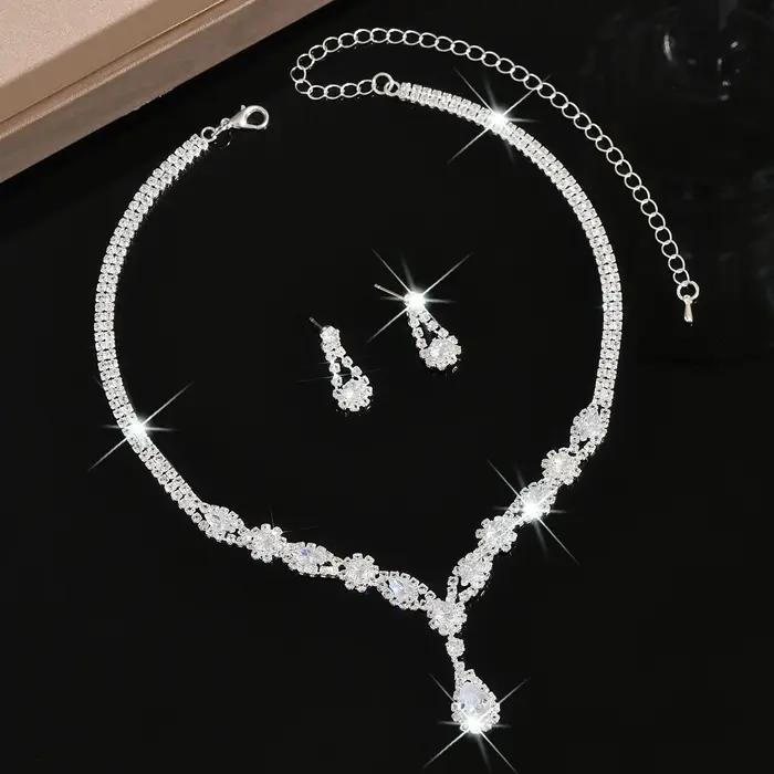 Parure de bijoux de luxe en cristal argenté en forme de goutte pour femme, collier en V et boucles d