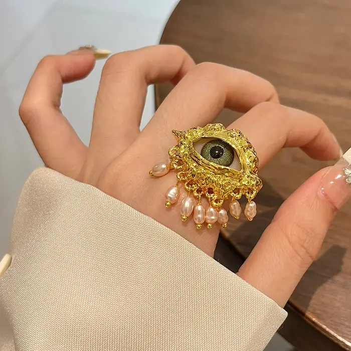 Boucles d'oreilles avec pompon en biscuits perlé pour femmes, yeux exagérés, personnalité unique, bi