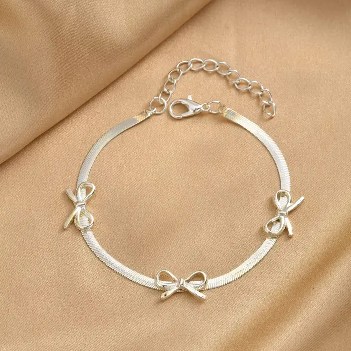 Bracelet Nœud Papillon Argenté avec Chaîne Serpent et Ruban
