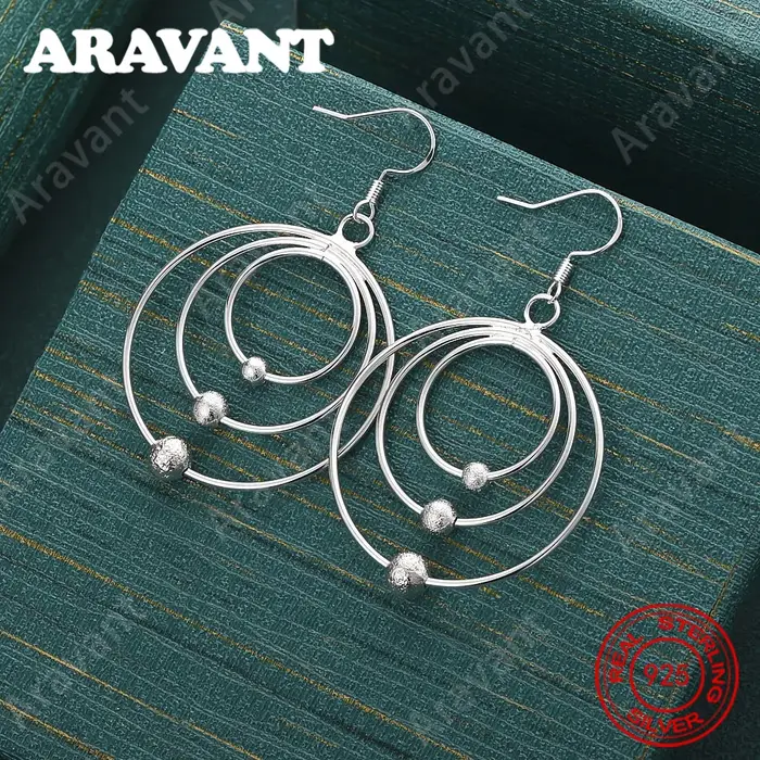 Boucles d'oreilles créoles entrelacées en argent sterling 925 - Un design frais et élégant pour les 