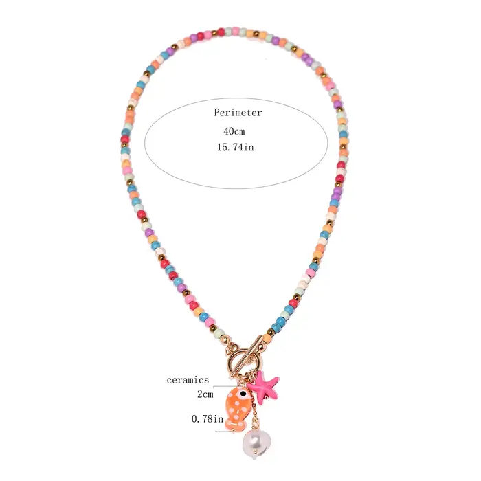 Collier bohème avec pendentif poisson et étoile de mer en céramique d'inspiration marine avec perles turquoise