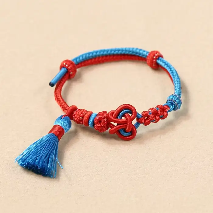 Bracelet tressé fait main style chinois 2026, nœud d'amour réglable avec pompon, motif fleur de pêch