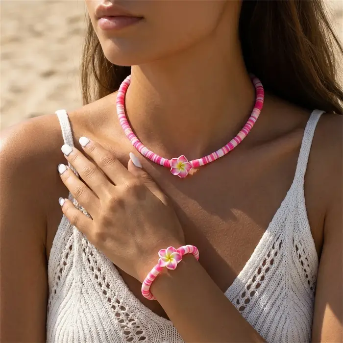 Ensemble collier et bracelet en pâte polymère Frangipani