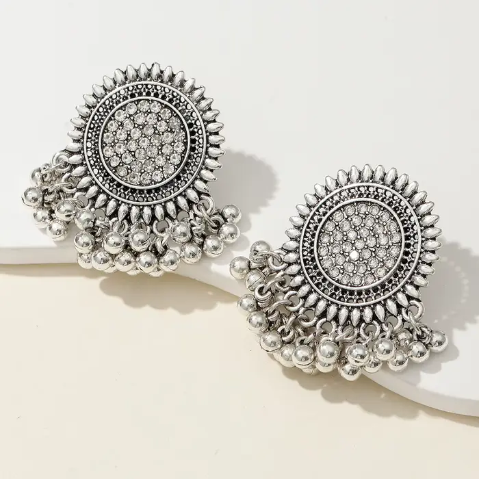 1 paire de boucles d'oreilles bohèmes vintage exagérées, design en métal ajouré complexe pour la mod