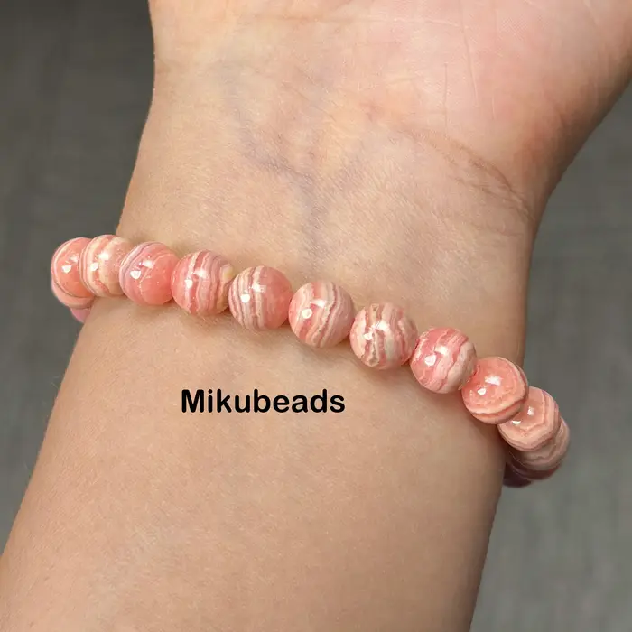 Perles rondes lisses en rhodochrosite naturelle 8-11.5mm 3A