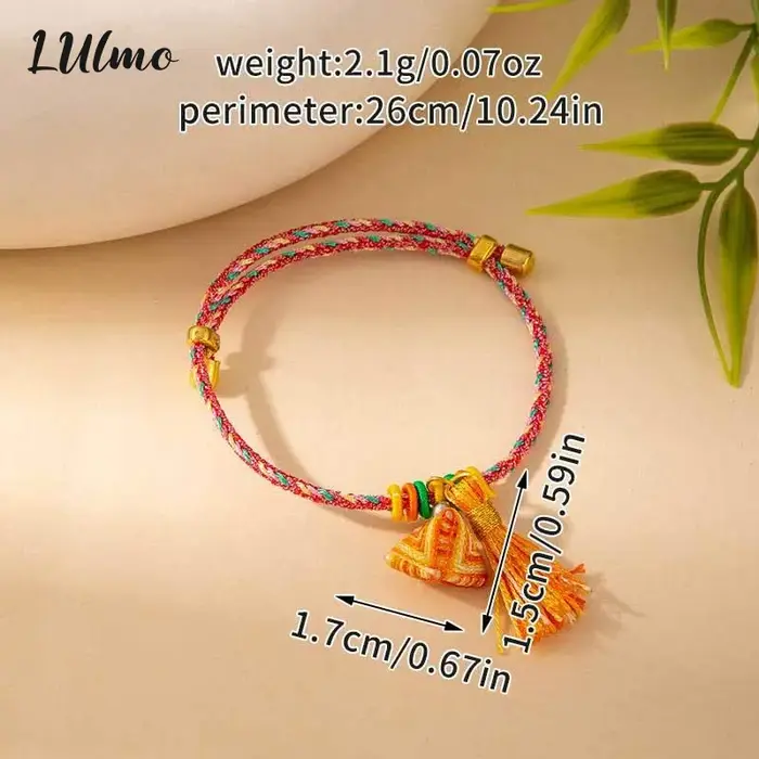 Bracelet tressé fait main avec breloque pompon