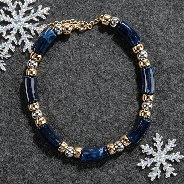 Collier statement en perles tubulaires effet marbre bleu marine avec entretoises dorées et argentées